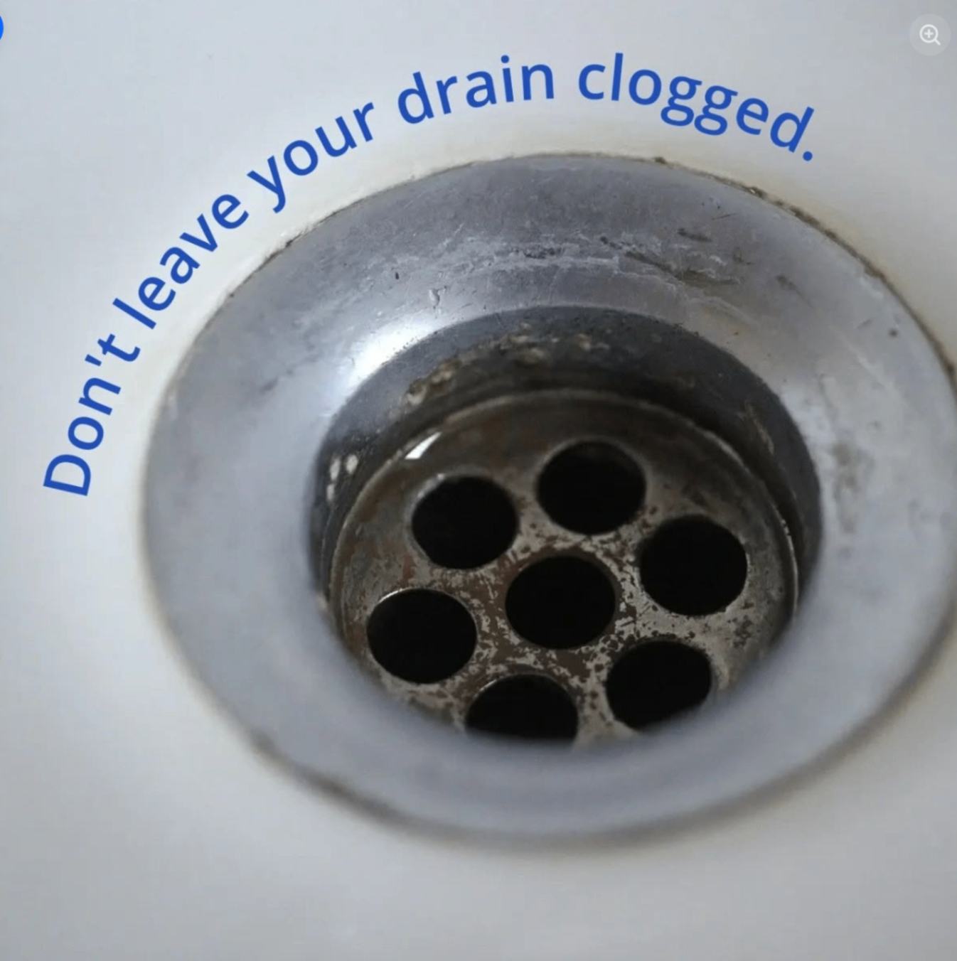 Close-up photo of a clogged drain